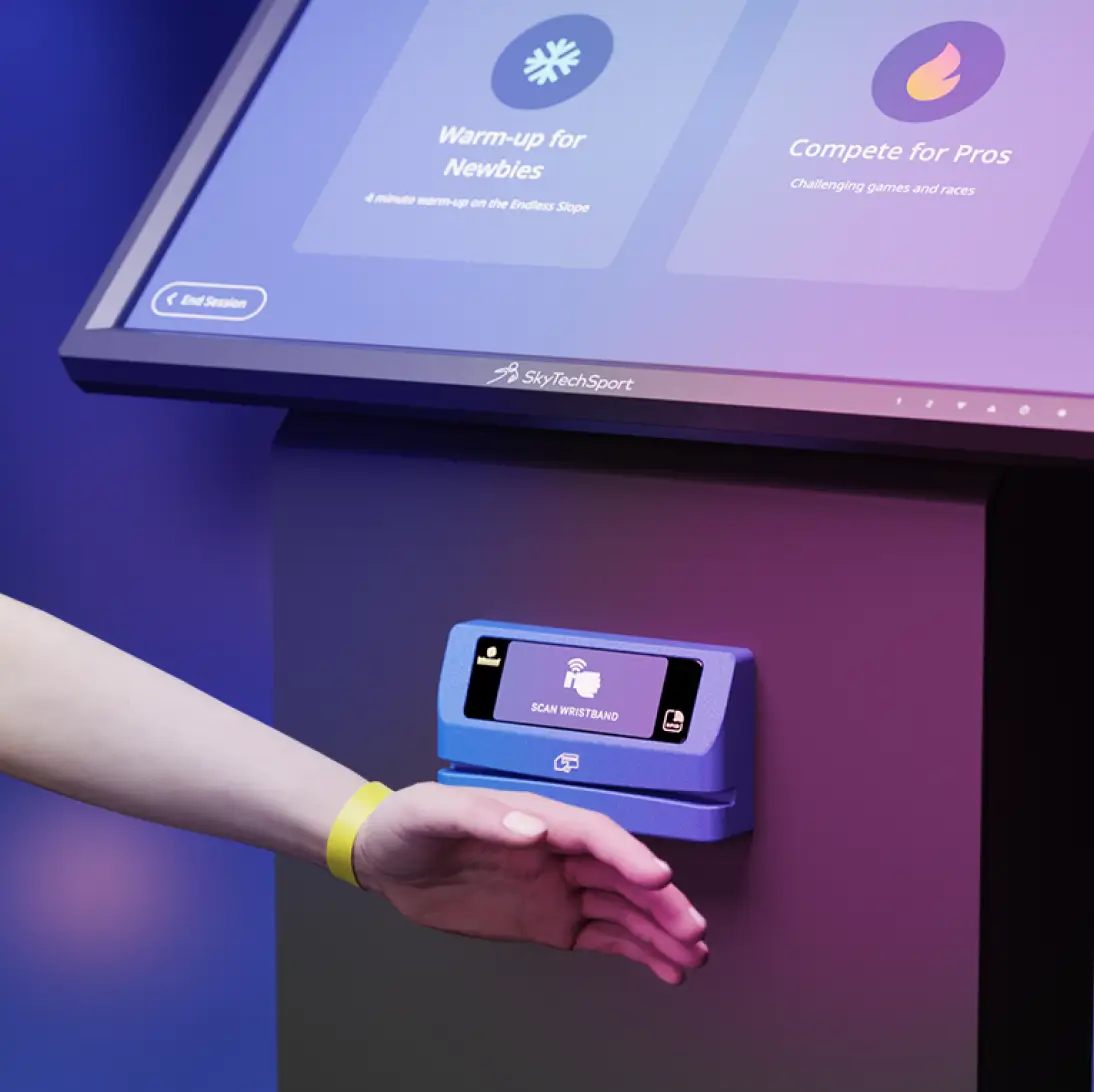 Person scanning his wrist at an RFID reader attached to a touchscreen kiosk